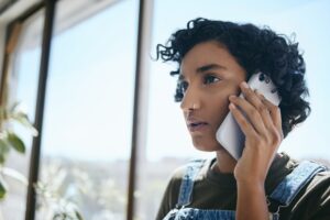 Business, phone call and woman from India in the office with a serious face. Businesswoman on smart