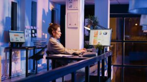 Female employee dealing with back pain at desk job